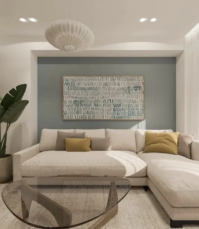 Living room with verdigris wall and corner sofa