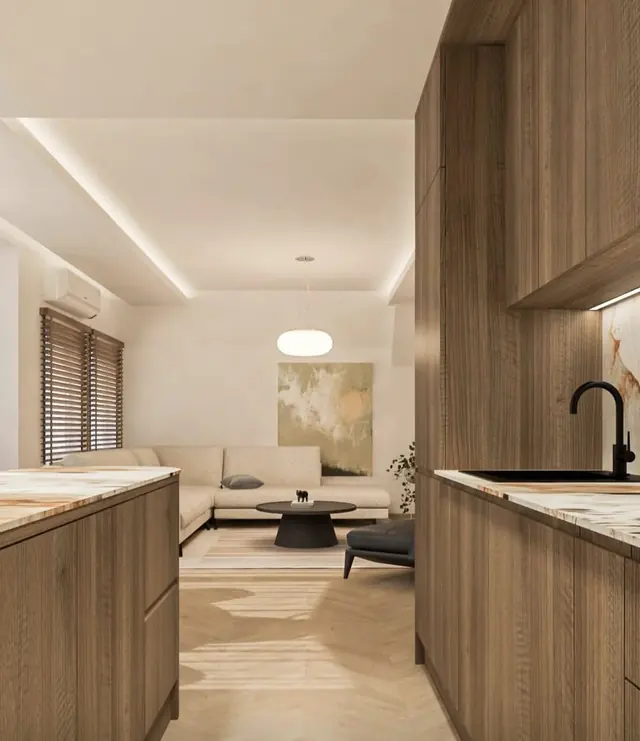 Open kitchen and living room with warm woodwork and a lit ceiling cove