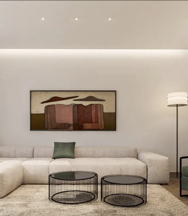 Living room with large sofa and cove lighting