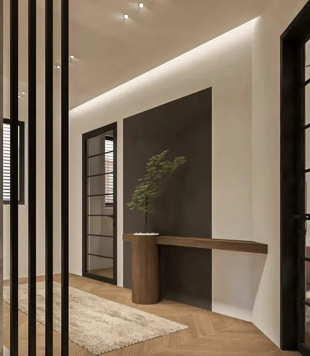 Entrance with black slatted partition and anthracite wall