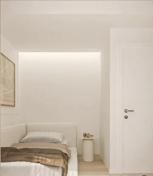 Minimalist bedroom with white walls